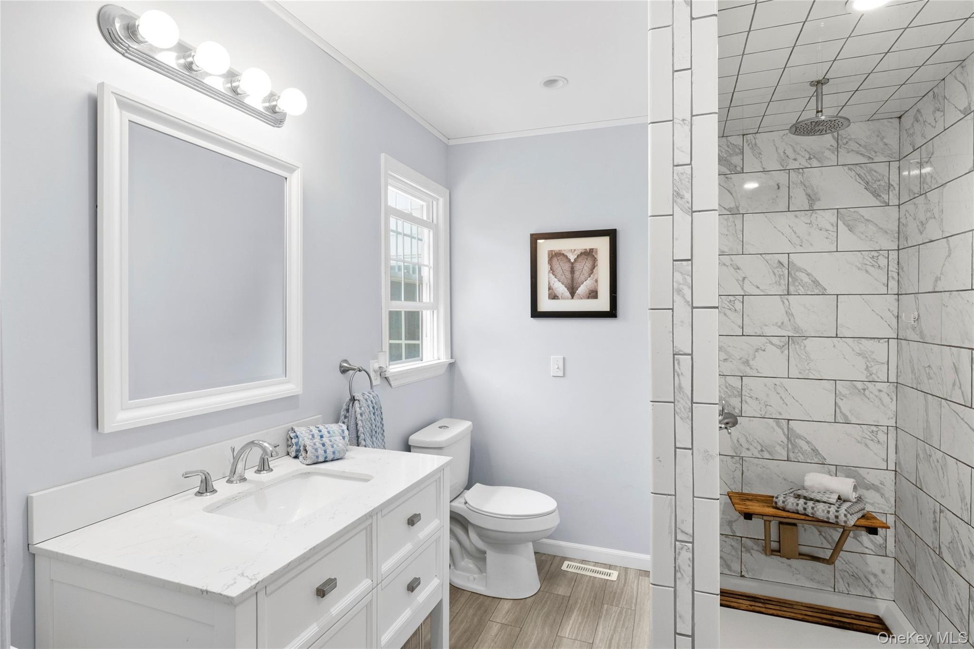 Stunning new spa like primary bathroom with walk in shower.