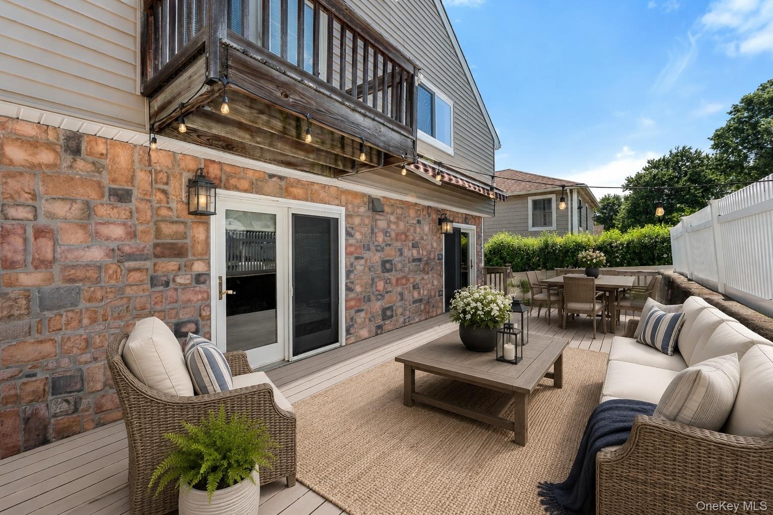 Virtually staged deck with access to the family room and the dine-in kitchen.