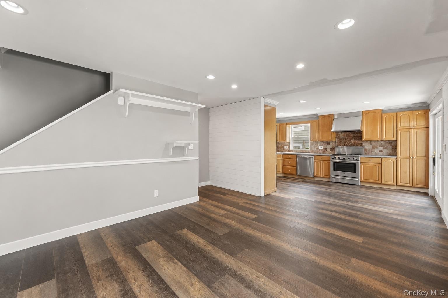 View from Family Room looking into Kitchen and back staircase.