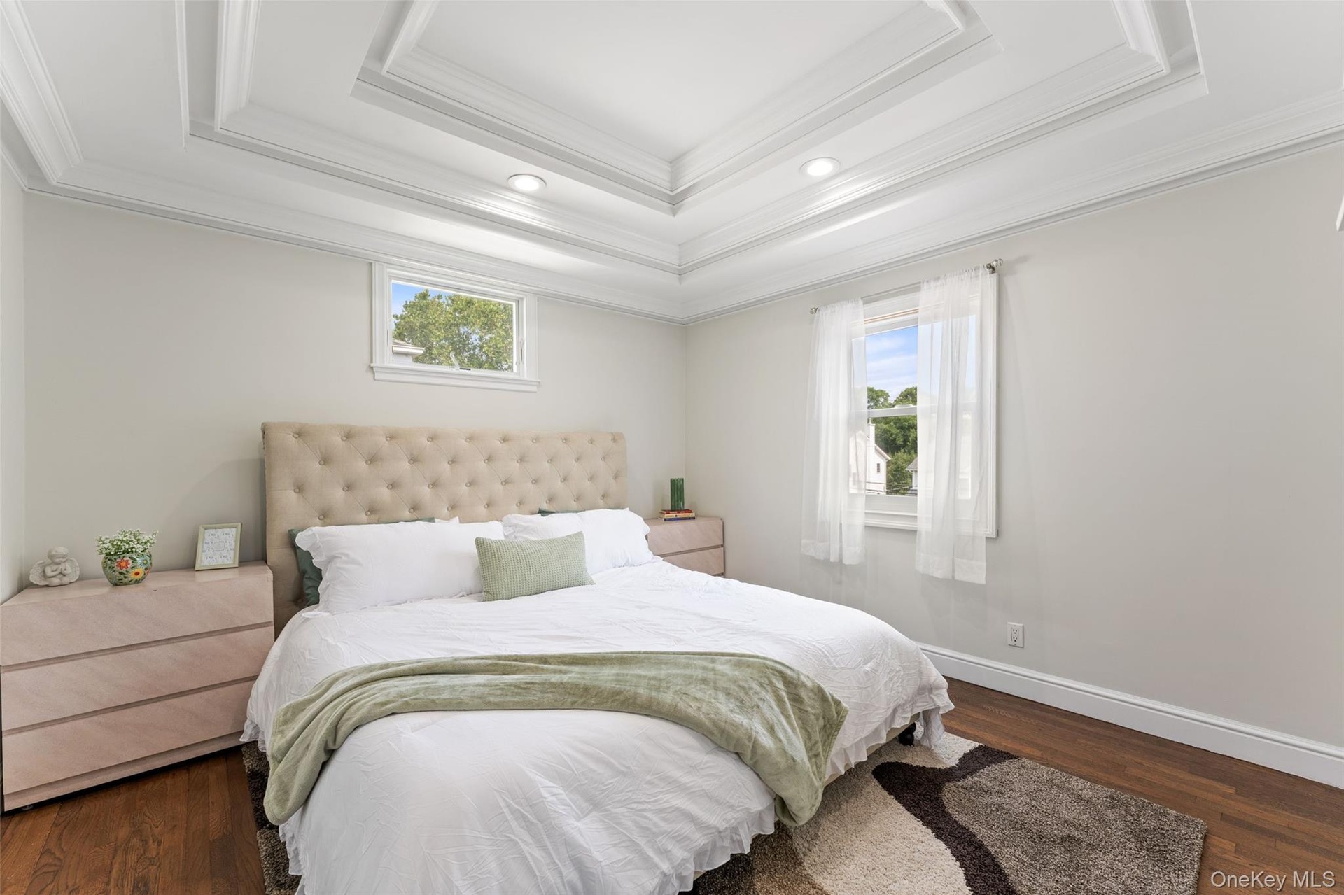 Primary Bedroom.featuring tray ceiling.