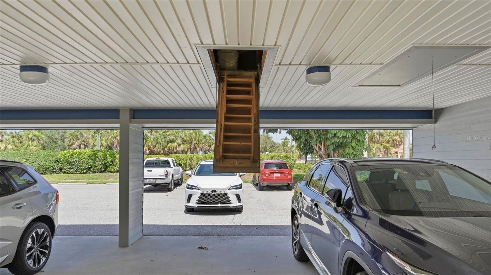 Car port and entry to storage above