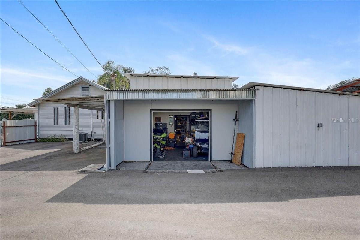 West side of main office storage with garage and remote opener