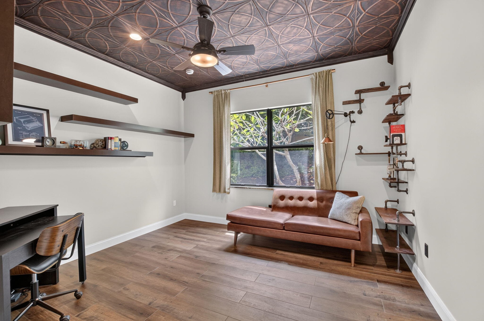 Ornate patterned ceiling with integrated lighting and ceiling fan