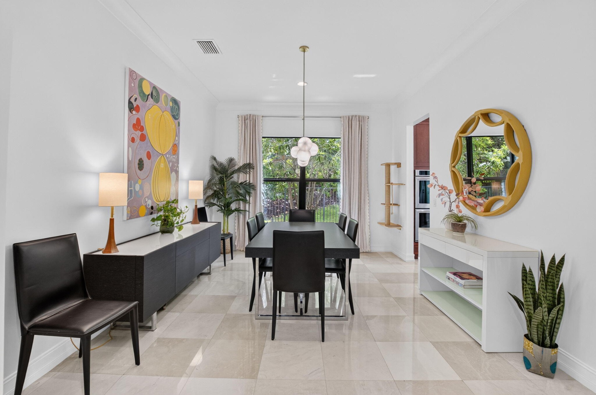 Spacious interior room featuring light-toned tile flooring, recessed lighting, and crown molding