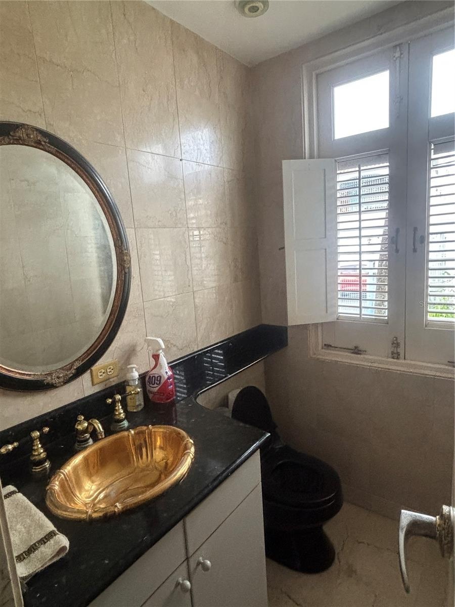 1st Floor Half Bath next to Laundry Room, Pantry and Kitchen.