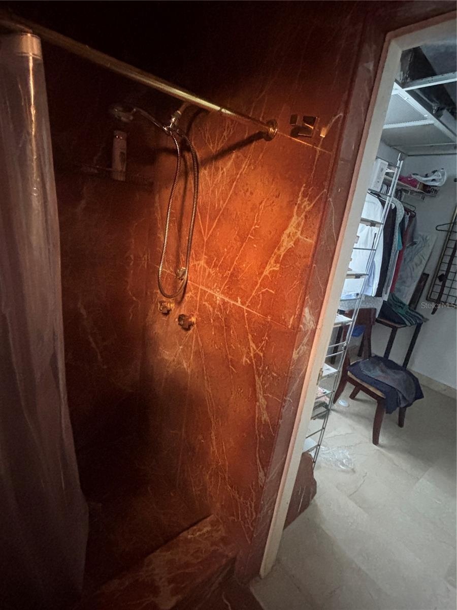 Primary bathroom has separate shower and entry to the walk-in closet.