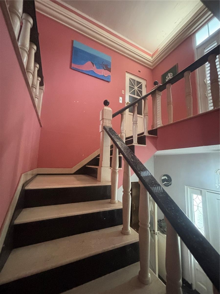 Marble and Granite Stairway to the second floor gallery. Elevator door is at the top of the stairs.