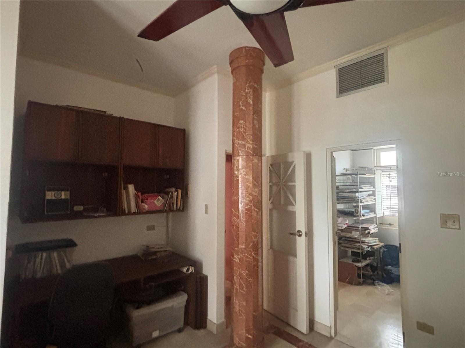 2nd Bedroom has entrance to the upper gallery, built-in closet area (used as office) and entry to walk-in closet.
