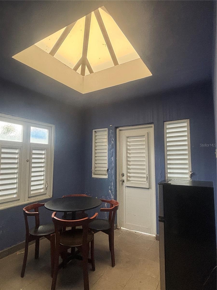 Breakfast Nook is a few steps up from the Kitchen and door to the side entryway.