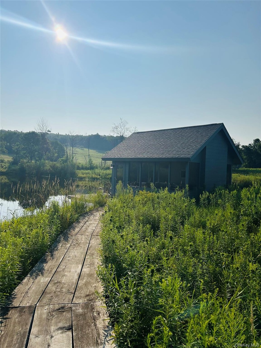 Path to pond and screened porch