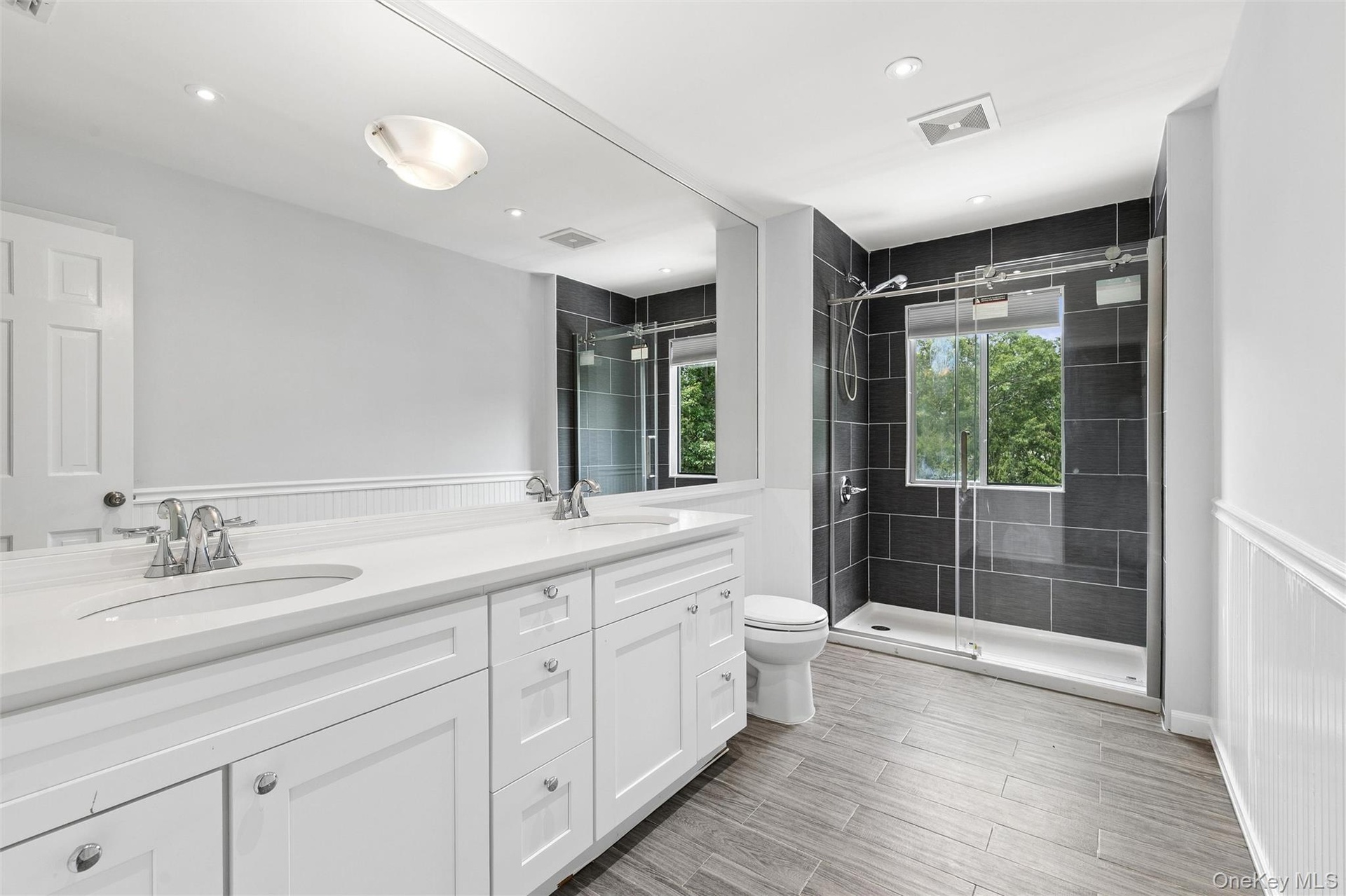 Second story full bath with dual sinks and walk in shower