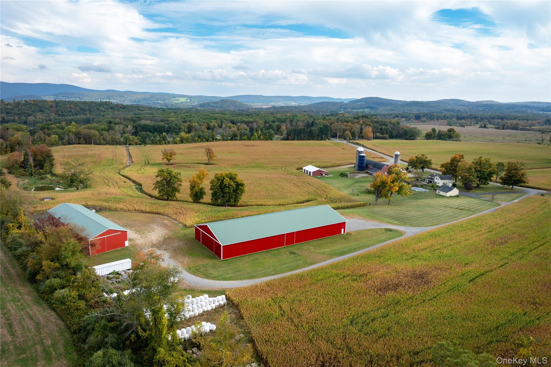 Backdrop for the farm, riding area and hay barn in the fore ground