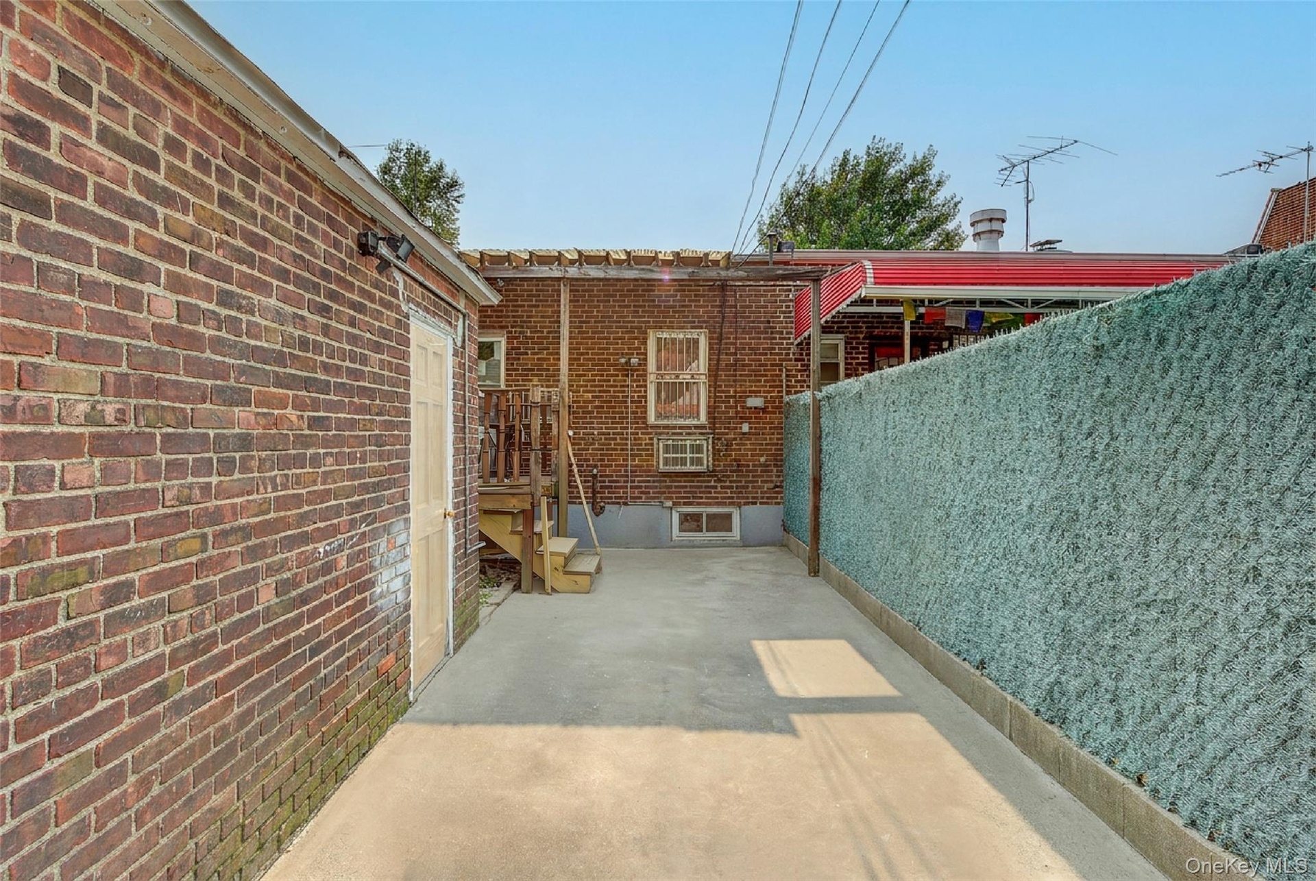 backyard space/ entrance to garage