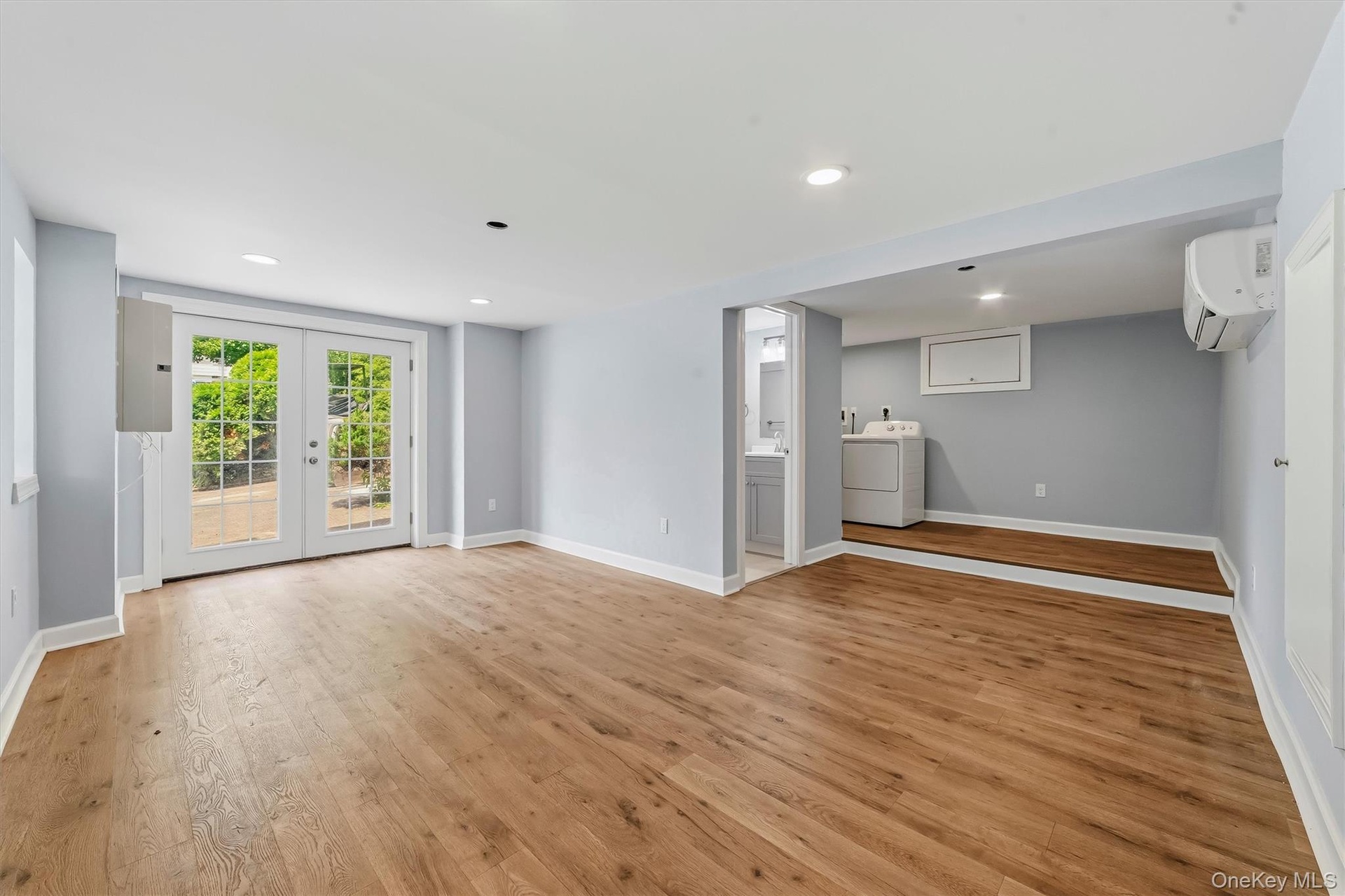Large family room with French doors to patio, washer/dryer & full new bath