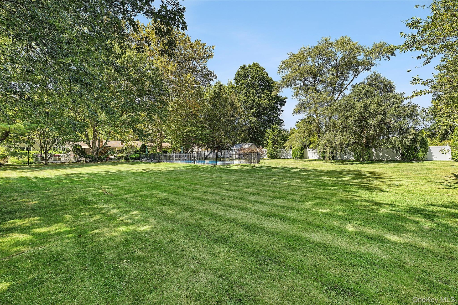 Flat property with mature trees