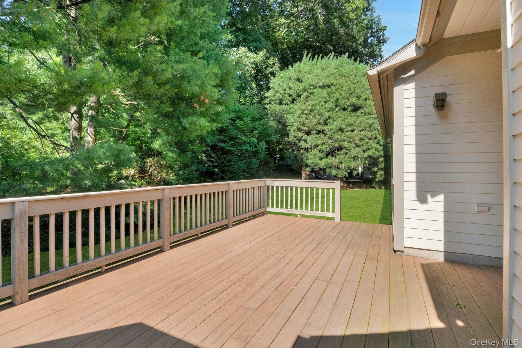 Another view of the yard and deck
