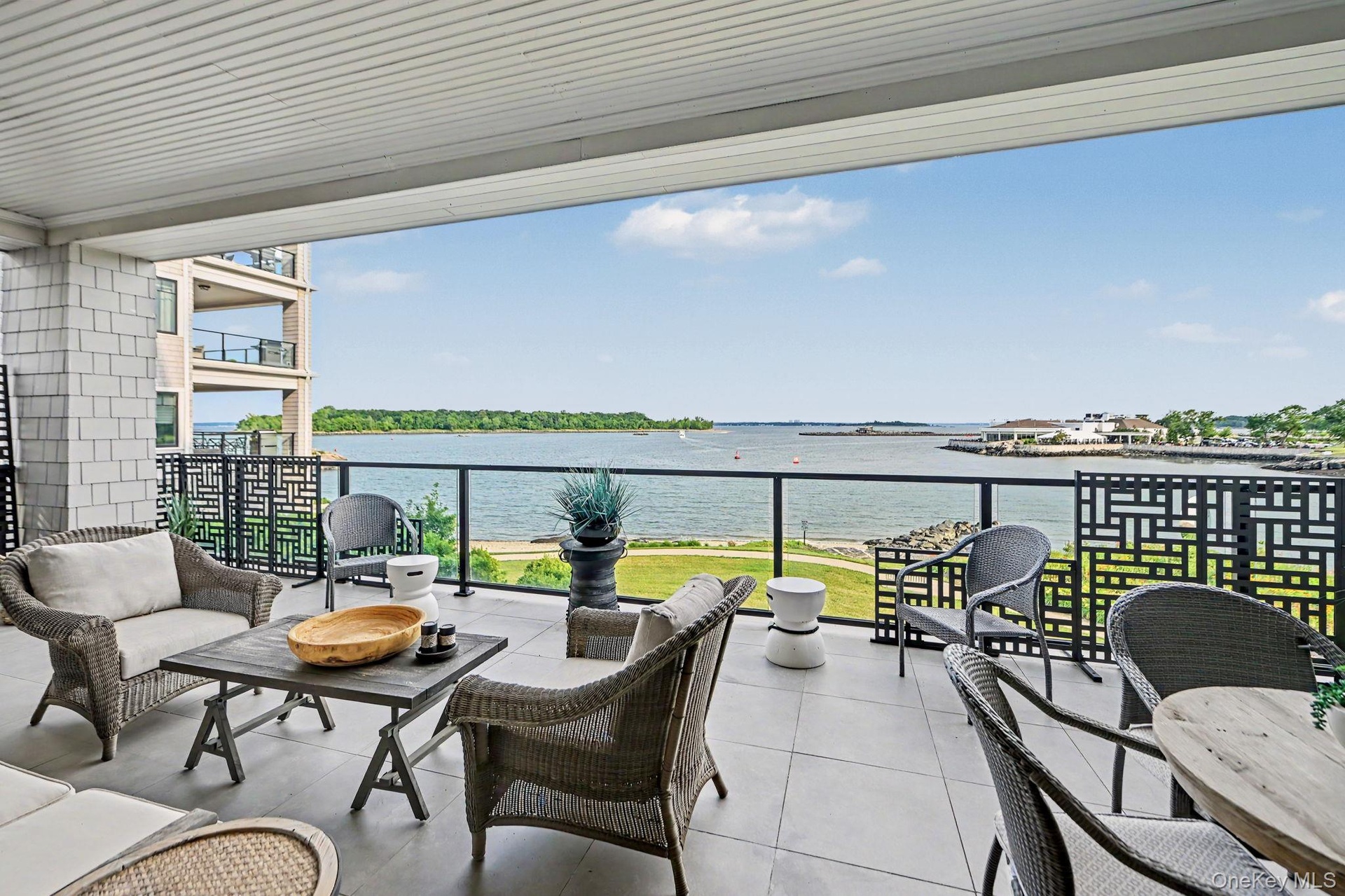 Large covered terrace with unobstructed views of the water