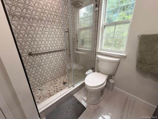 Primary Bathroom Shower with beautiful tile.