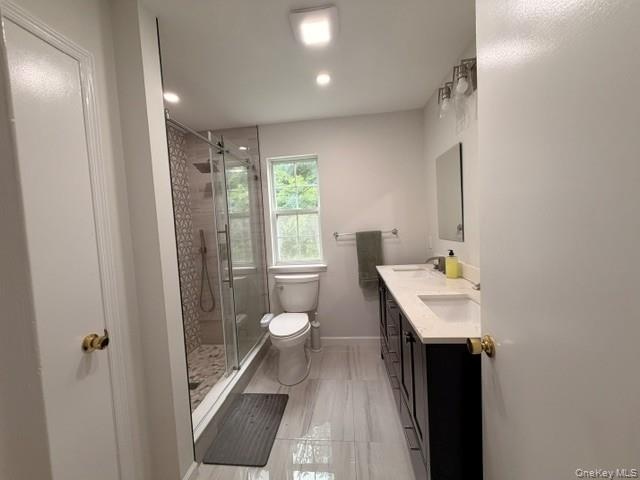 New Primary Bathroom with double sinks and pretty floor