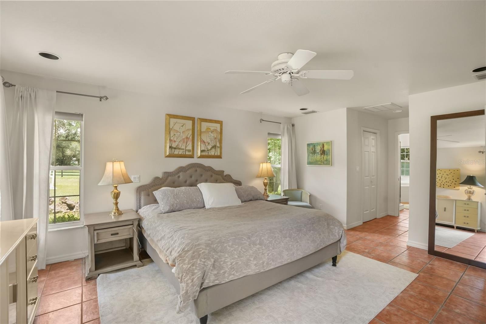 Large primary bedroom featuring tile flooring and ample space for a private retreat