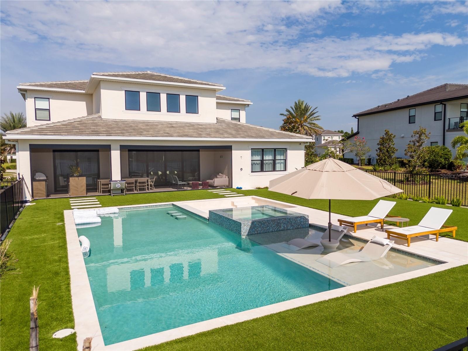 Pool with spa and fire pit