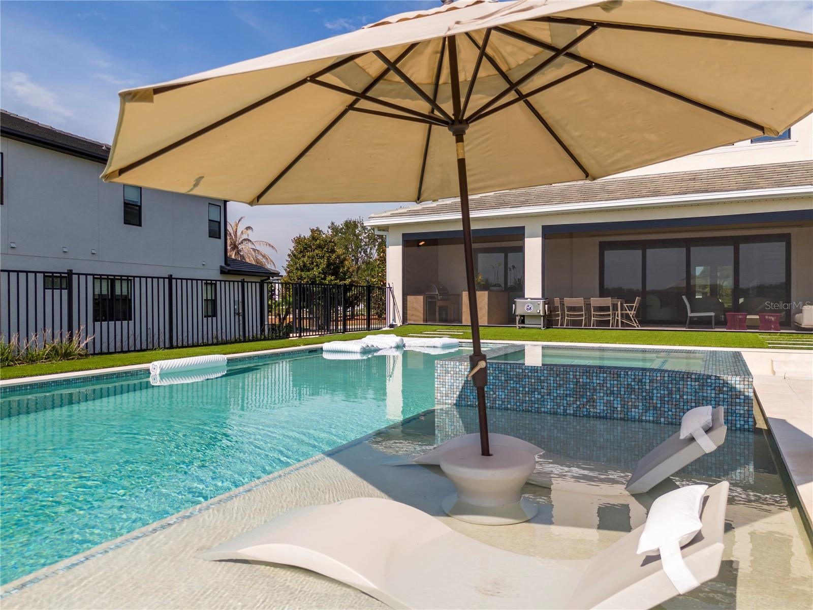 Pool with spa and fire pit