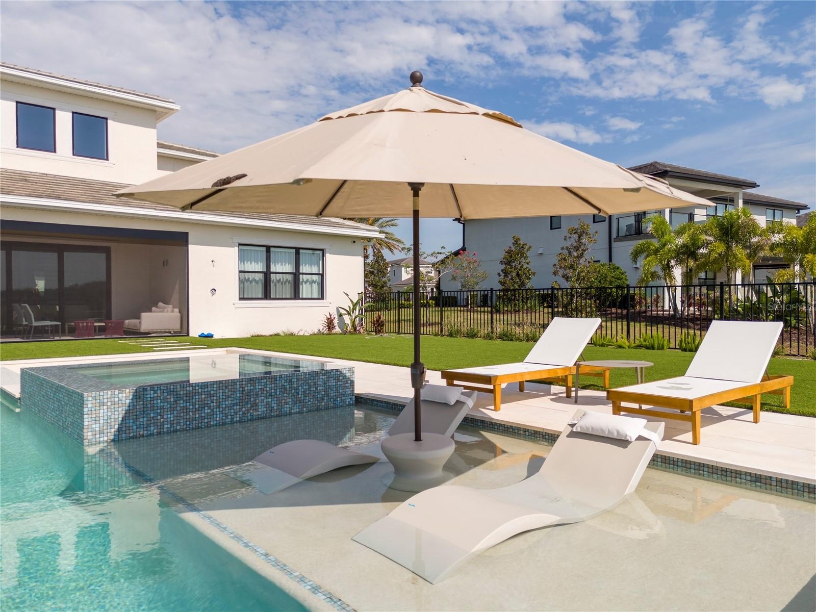 Pool with spa and fire pit
