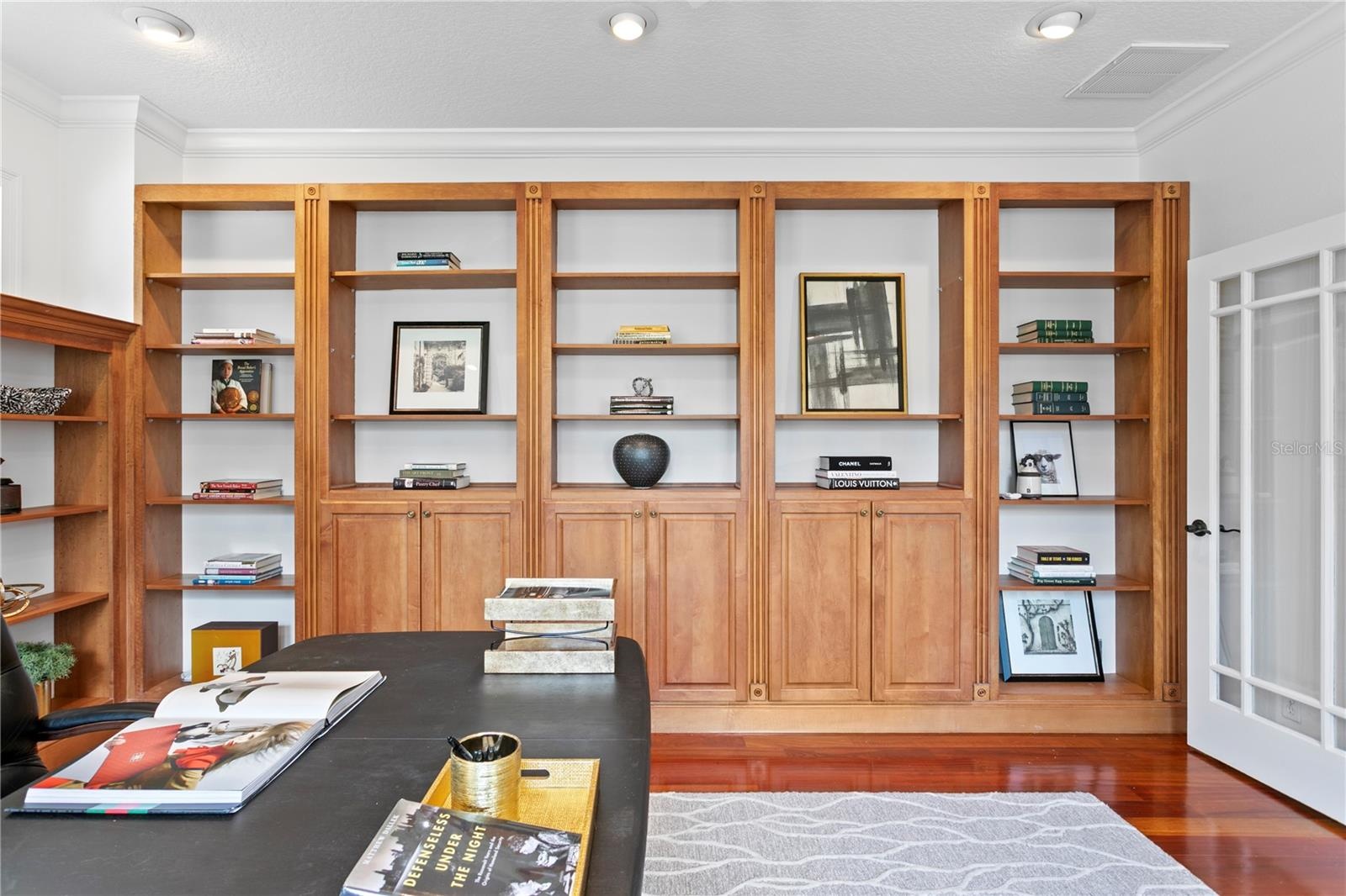 Bespoke floor-to-ceiling built-ins in the Office/Library offer both a striking visual statement & unparalleled storage