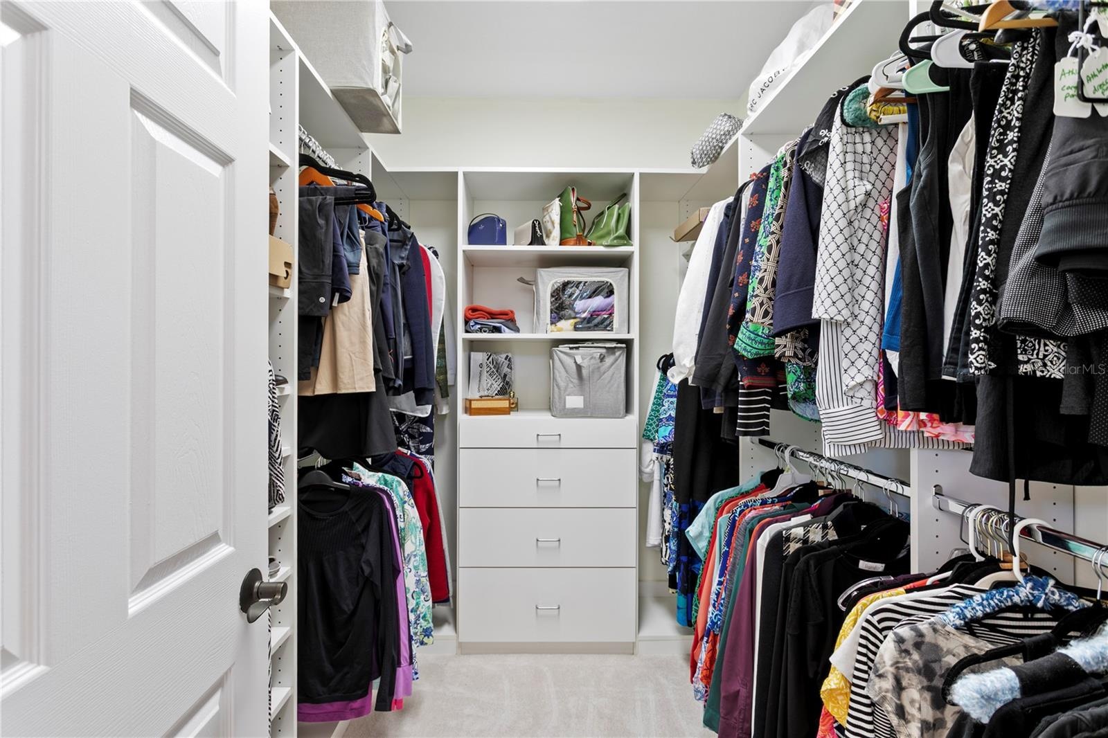 Owner's en suite features TWO Wardrobe sanctuaries, custom designed for tailored organization