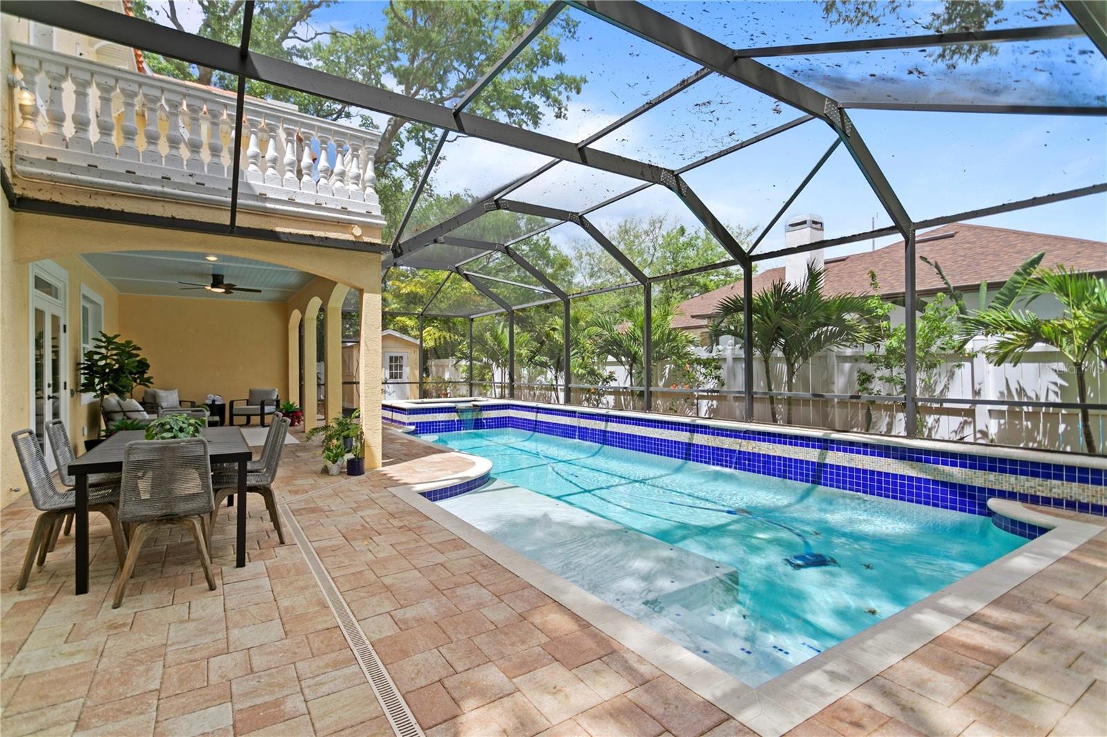 Resort-style pool & spa with mature tropical landscaping