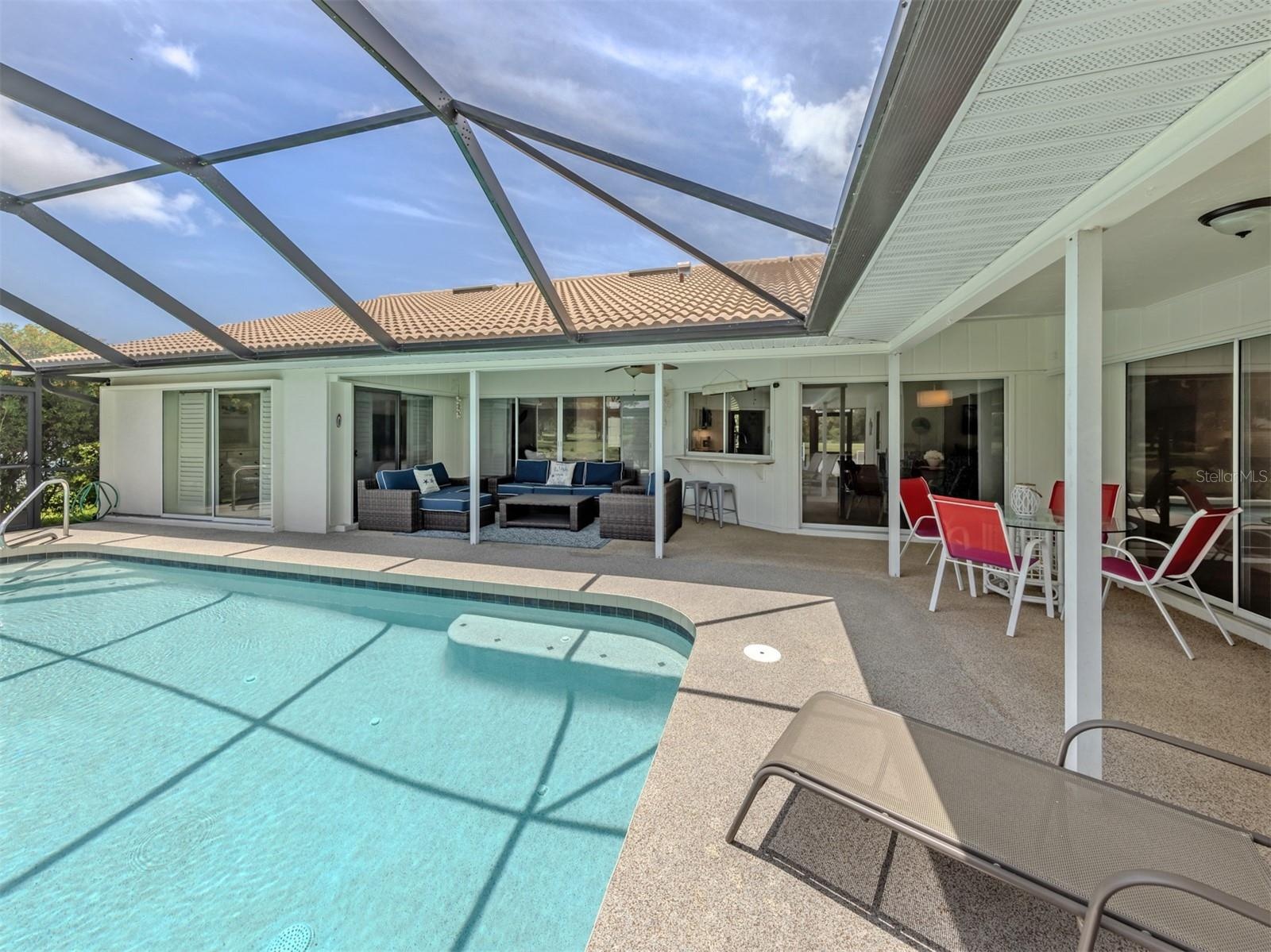 This spacious home opens from the primary, formal living, kitchen and hallway to the additional bedrooms allowing you to extend your living space outd