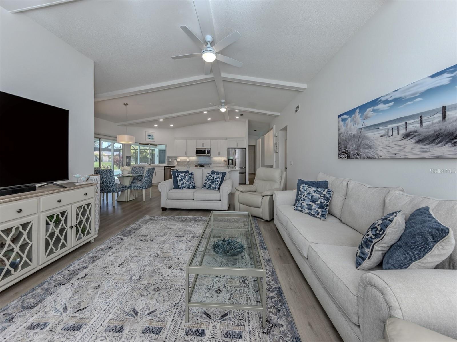 This warm and inviting space is the perfect place to enjoy a movie after a day at the beach on on the golf course