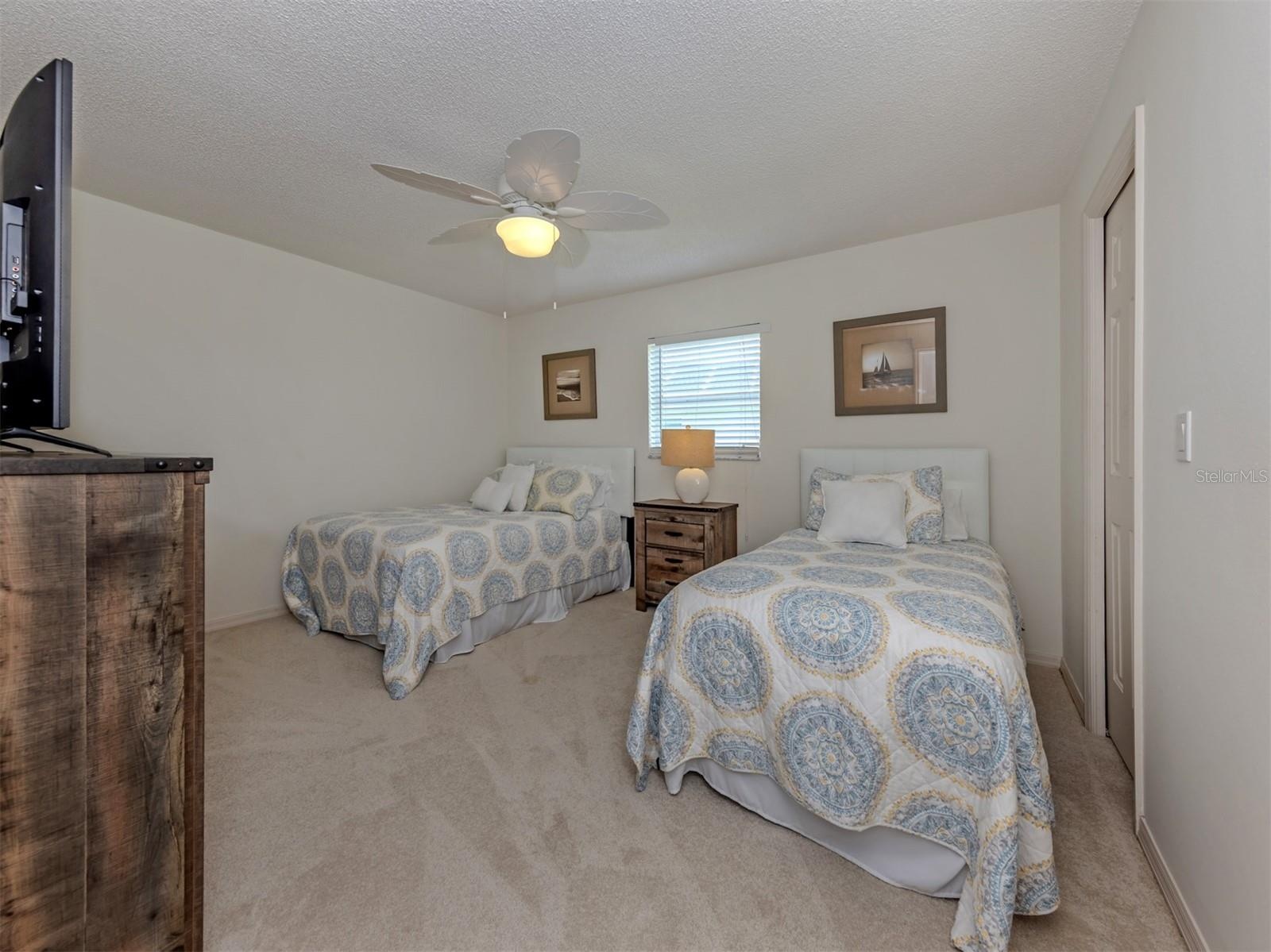 The second bedroom is located on the other side of the home and includes a walk in closet
