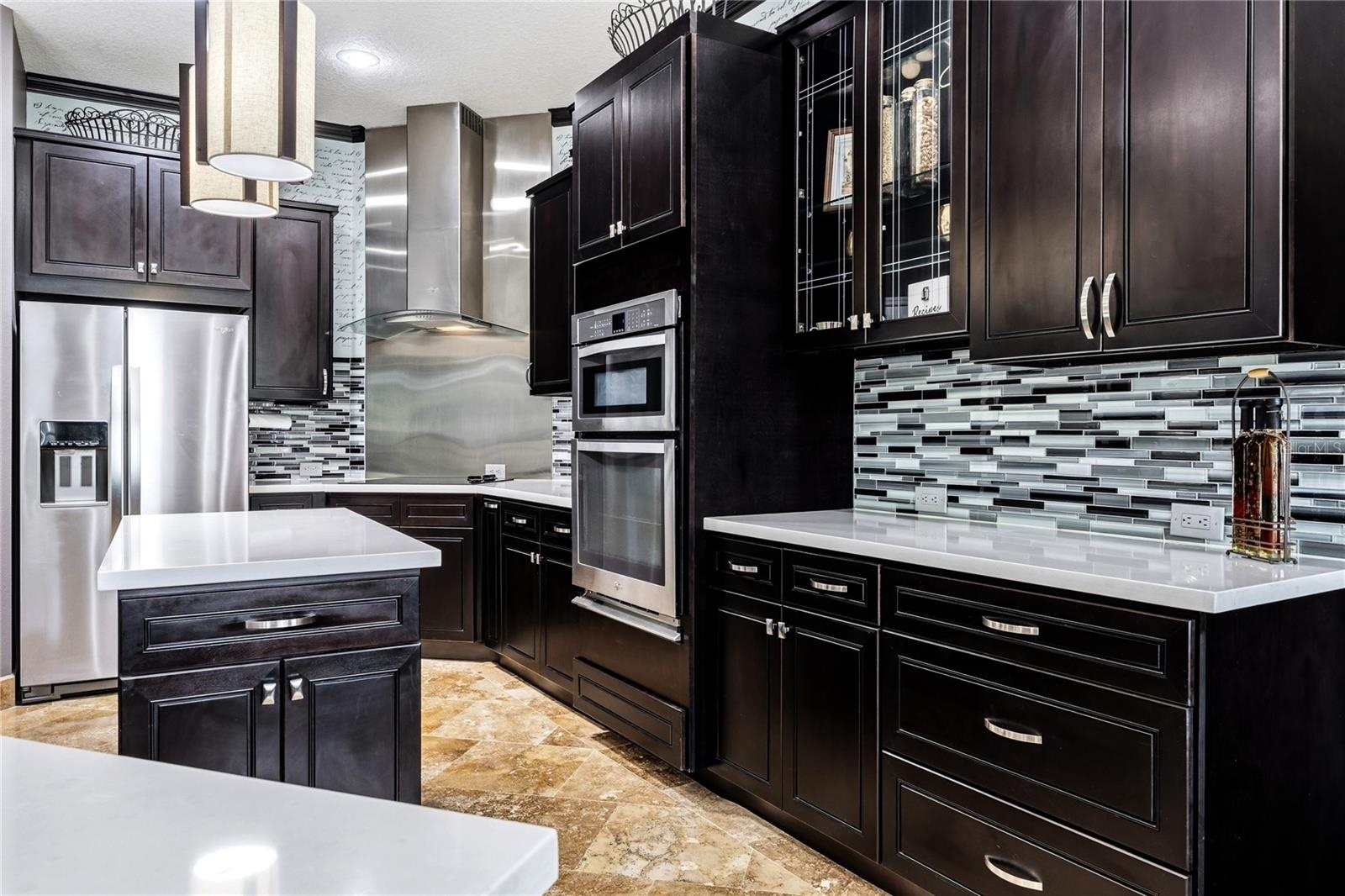 Lots of cabinetry with glass front accent and soft close.