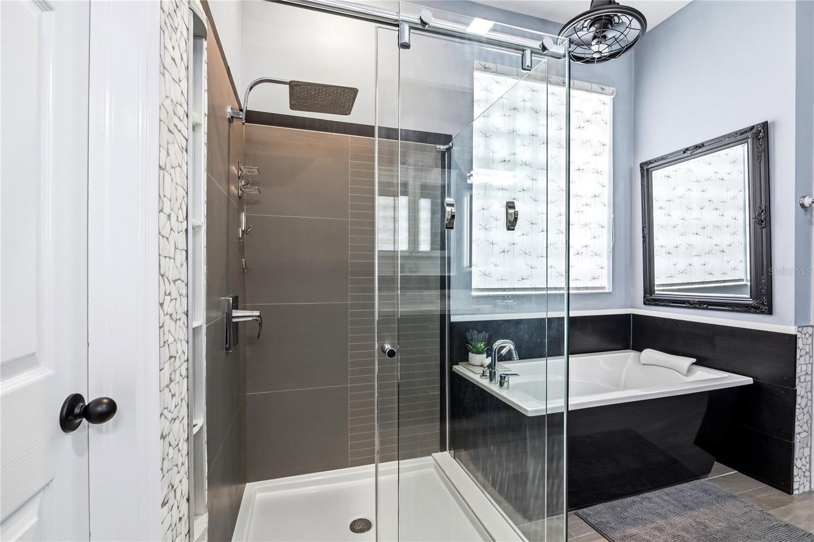 Tiled Shower with glass wall and entry door!