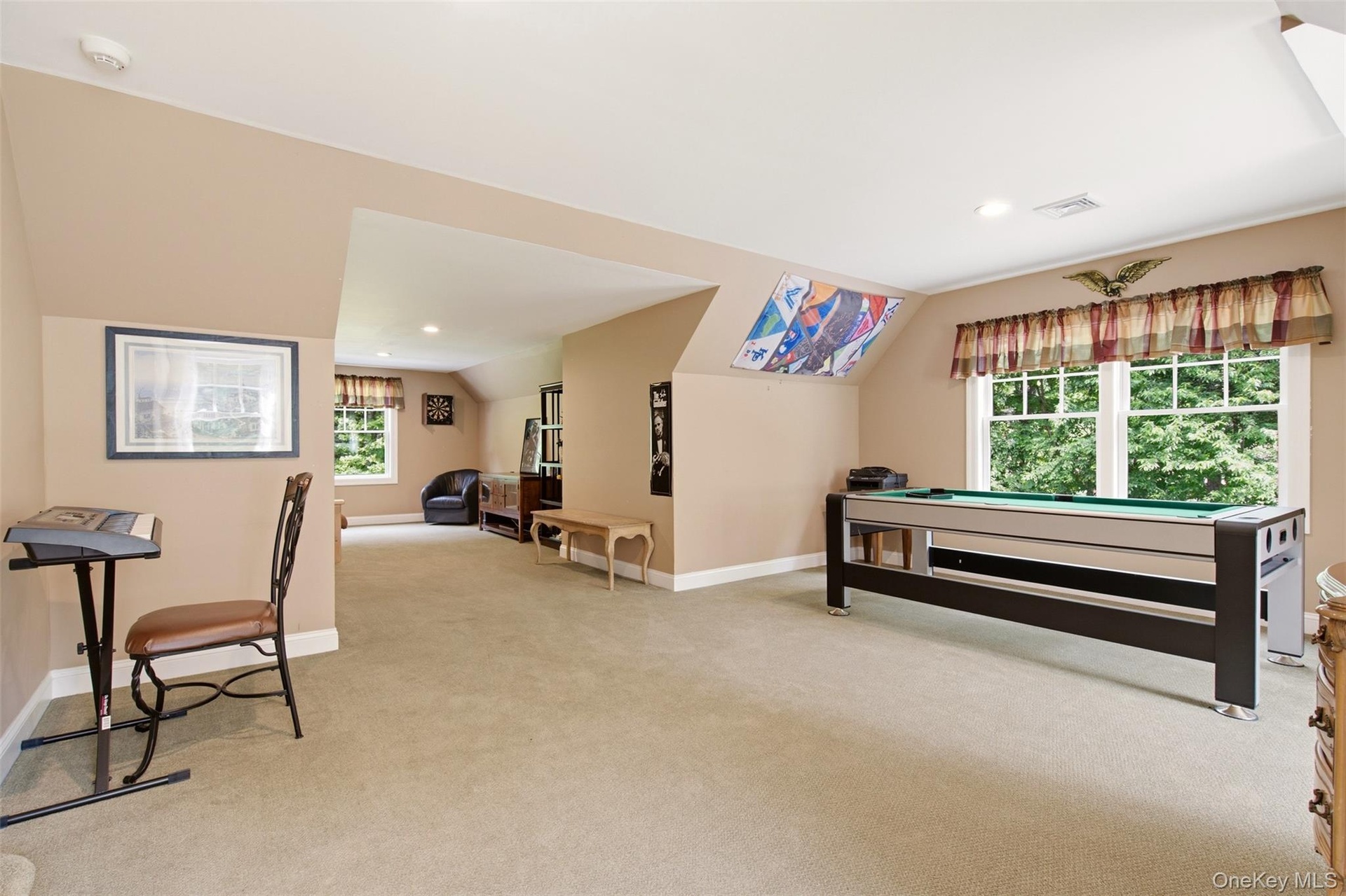Expansive game room just up backstairs from kitchen