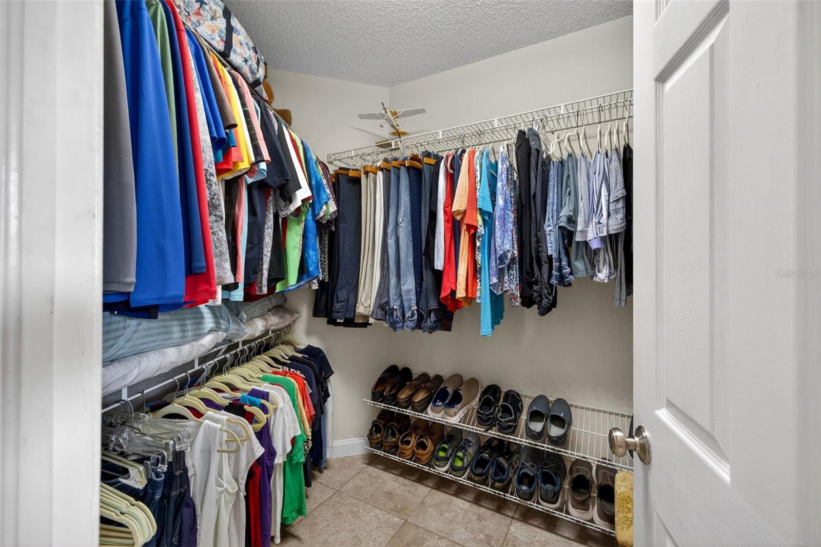 Walk-in closet is too large to fit in one photo!