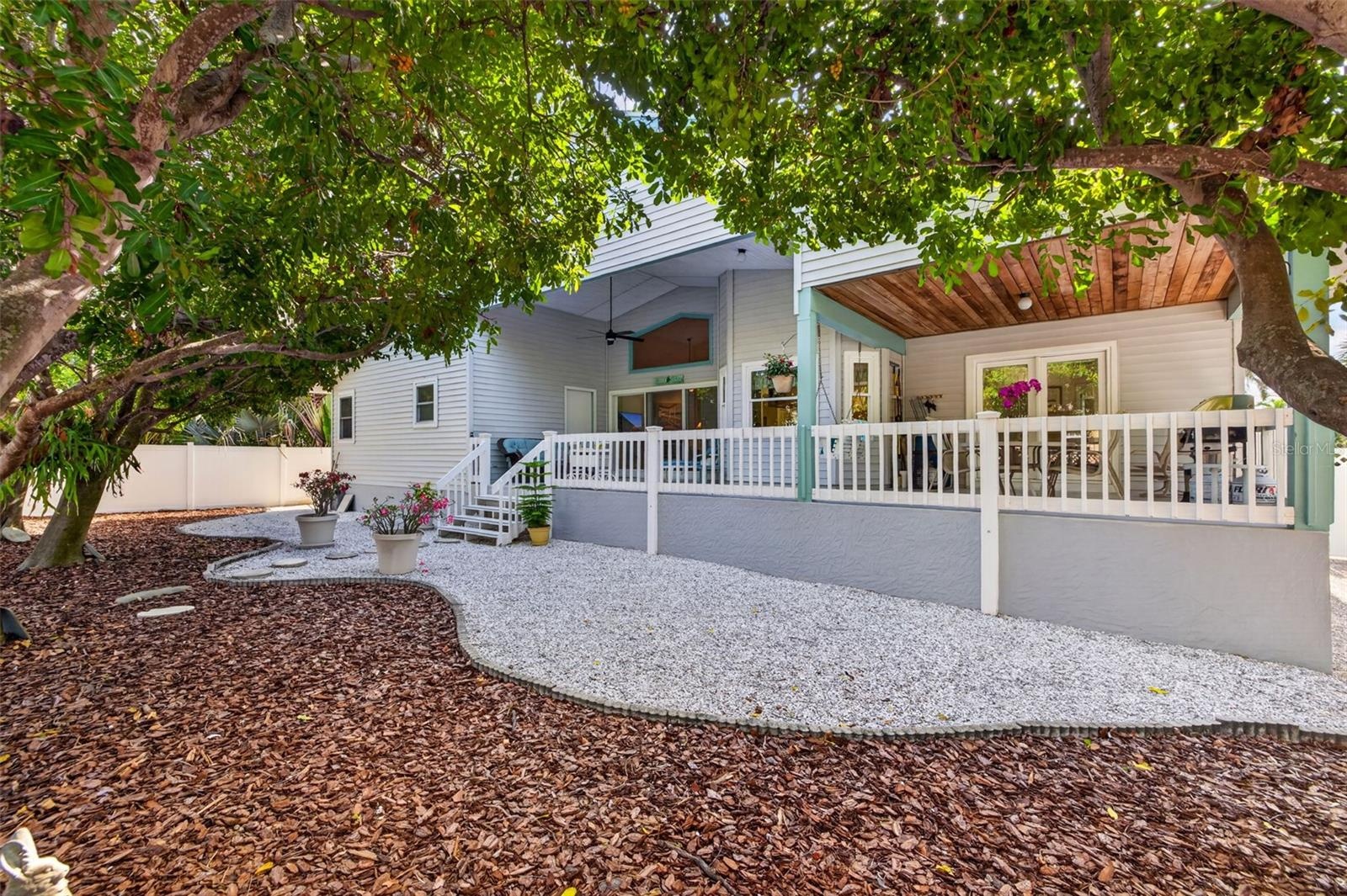 Large enough to add a pool, or enjoy this low maintenance yard just as it is