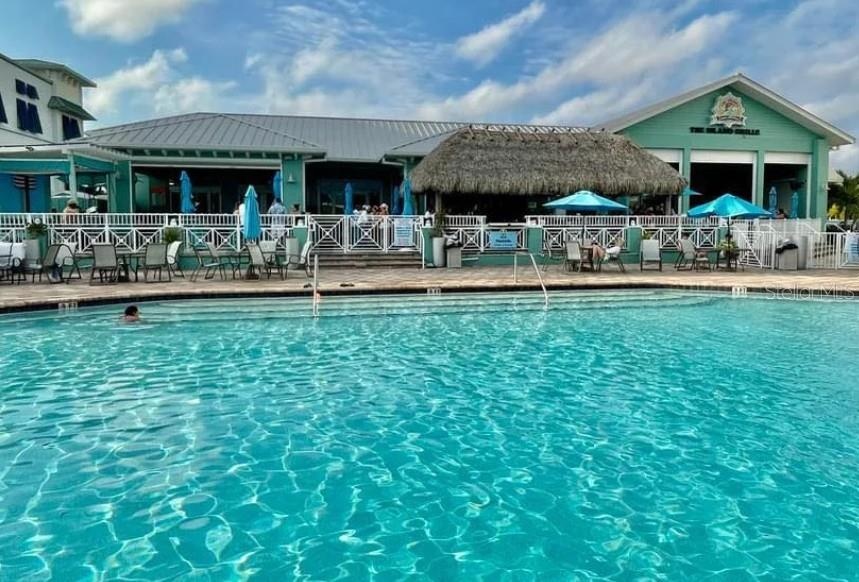 The Island Grille and Raw Bar. This serves as a community pool; for $7 you can purchase a wrist band at the Tiki Bar and enjoy food, drinks, live musi