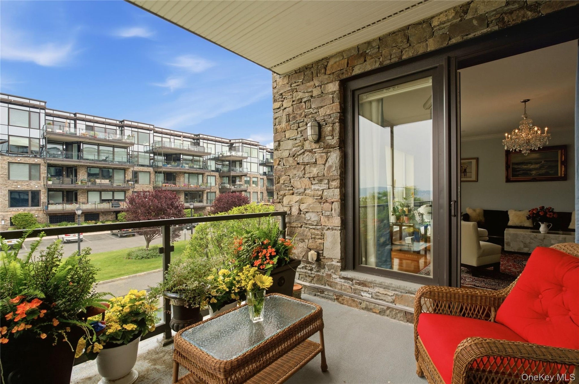View from the private balcony highlighting the bright living room and seamless indoor-outdoor living experience.