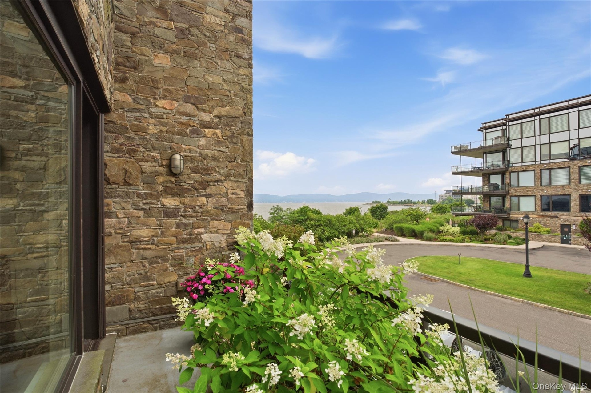 Private balcony off primary suite offering beautiful river views and a peaceful retreat.