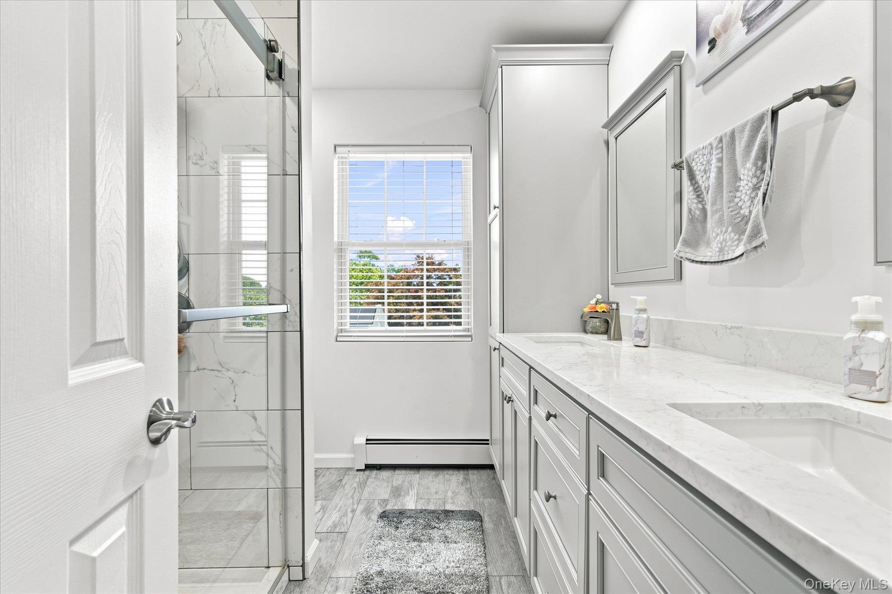 Brand new primary bathroom with instant hot water.