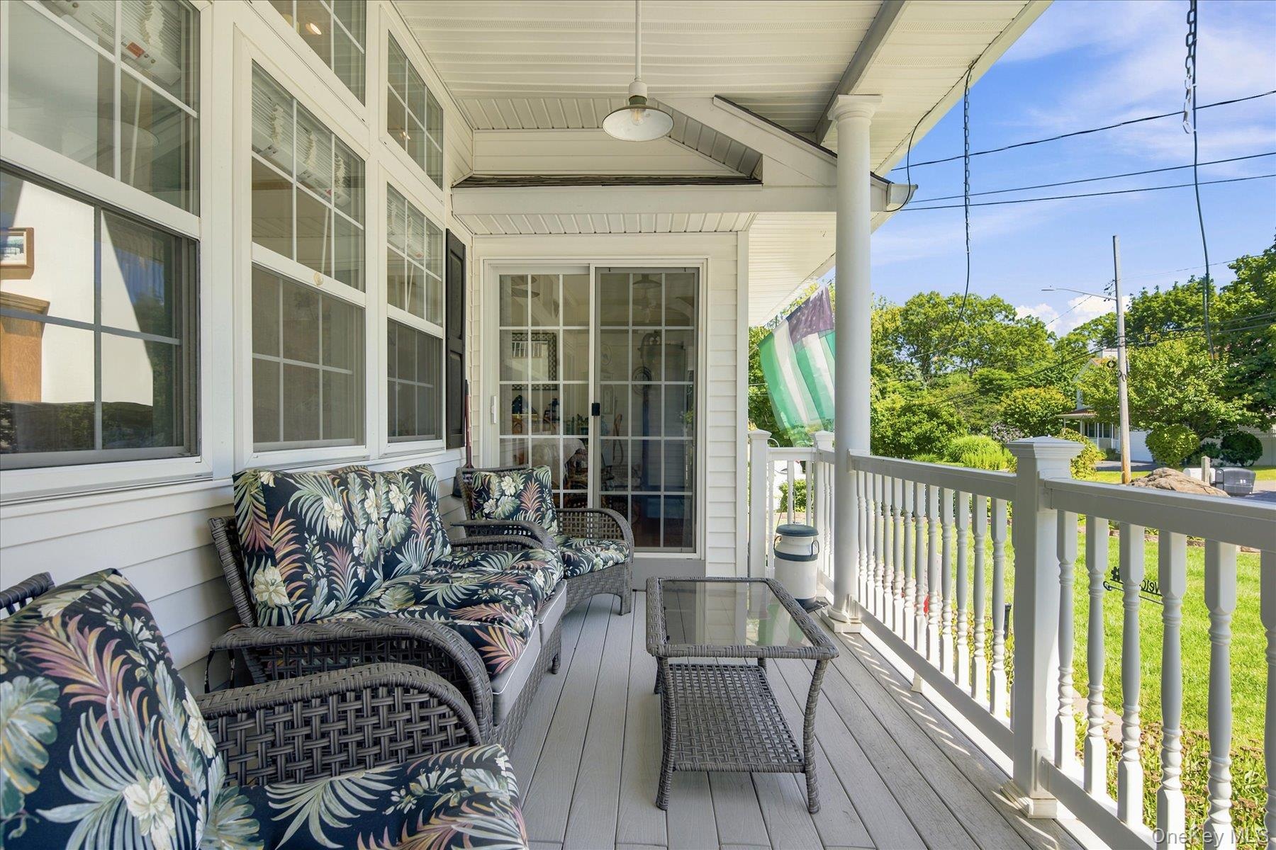 Cozy rocking chair porch with entry to great room or formal dining room