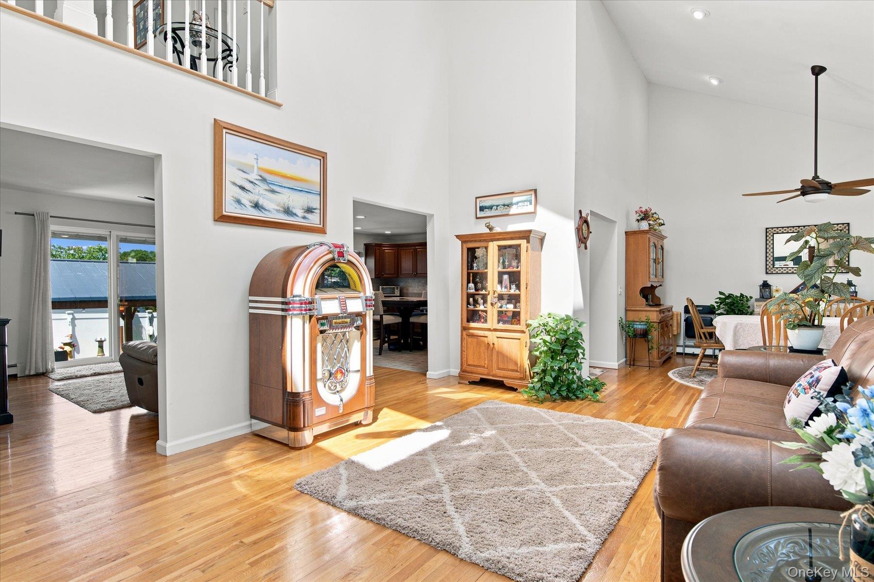 Gleaming hardwood floors, cathedral ceilings, open floor plan and high hats
