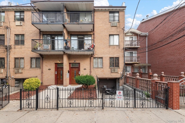 Brick facade building featuring multiple private balconies with black metal railings