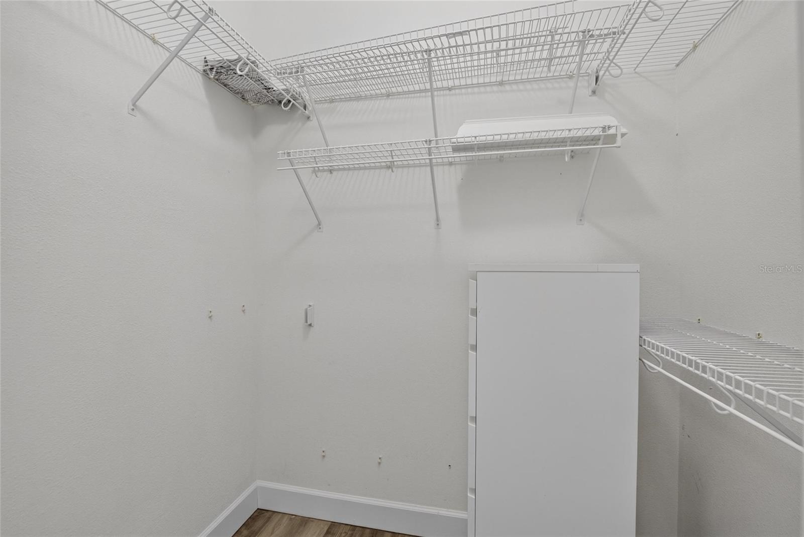 Primary Bedroom Walk in closet 1 of 2