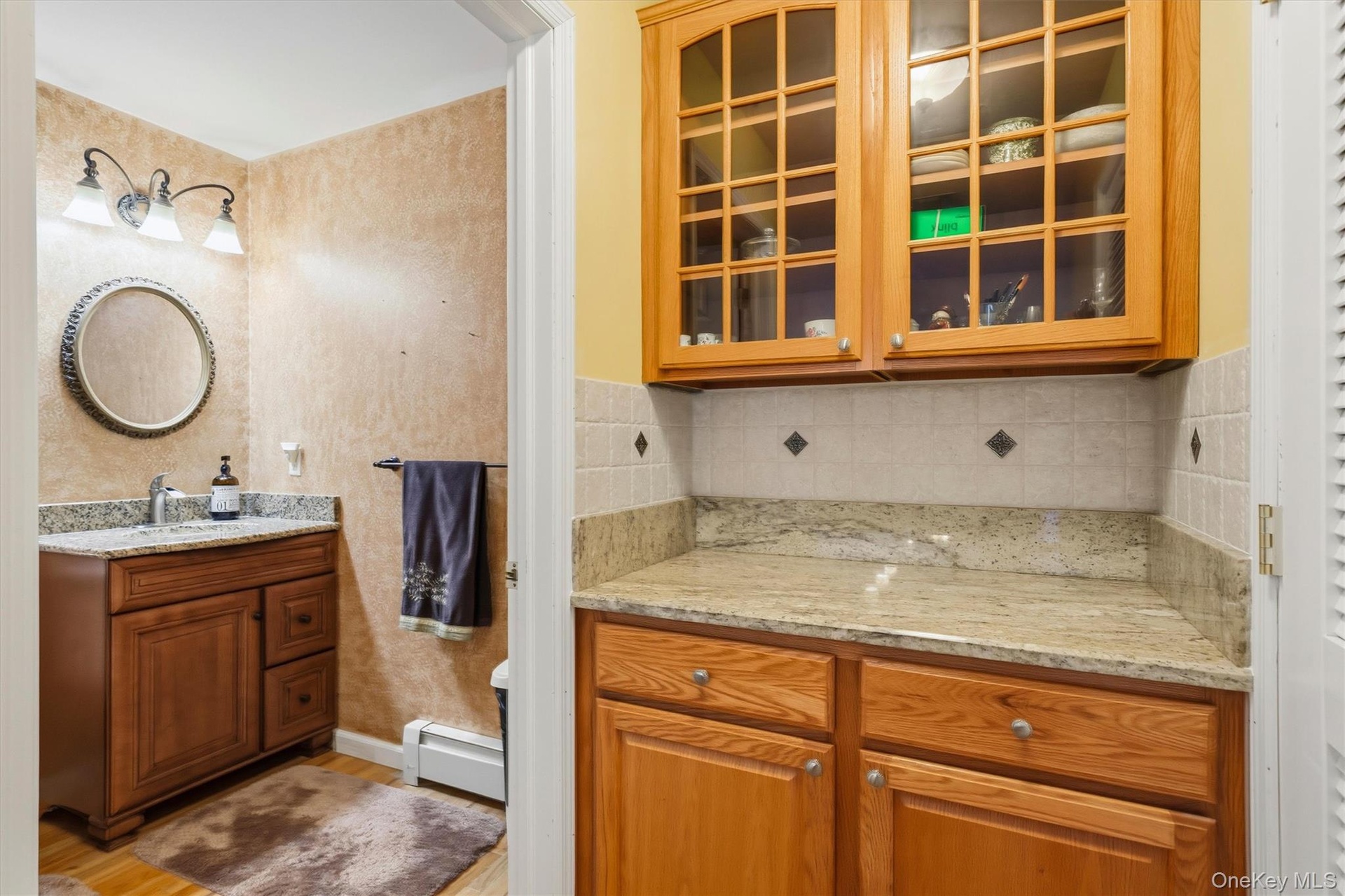 Lavatory at end of kitchen hallway.