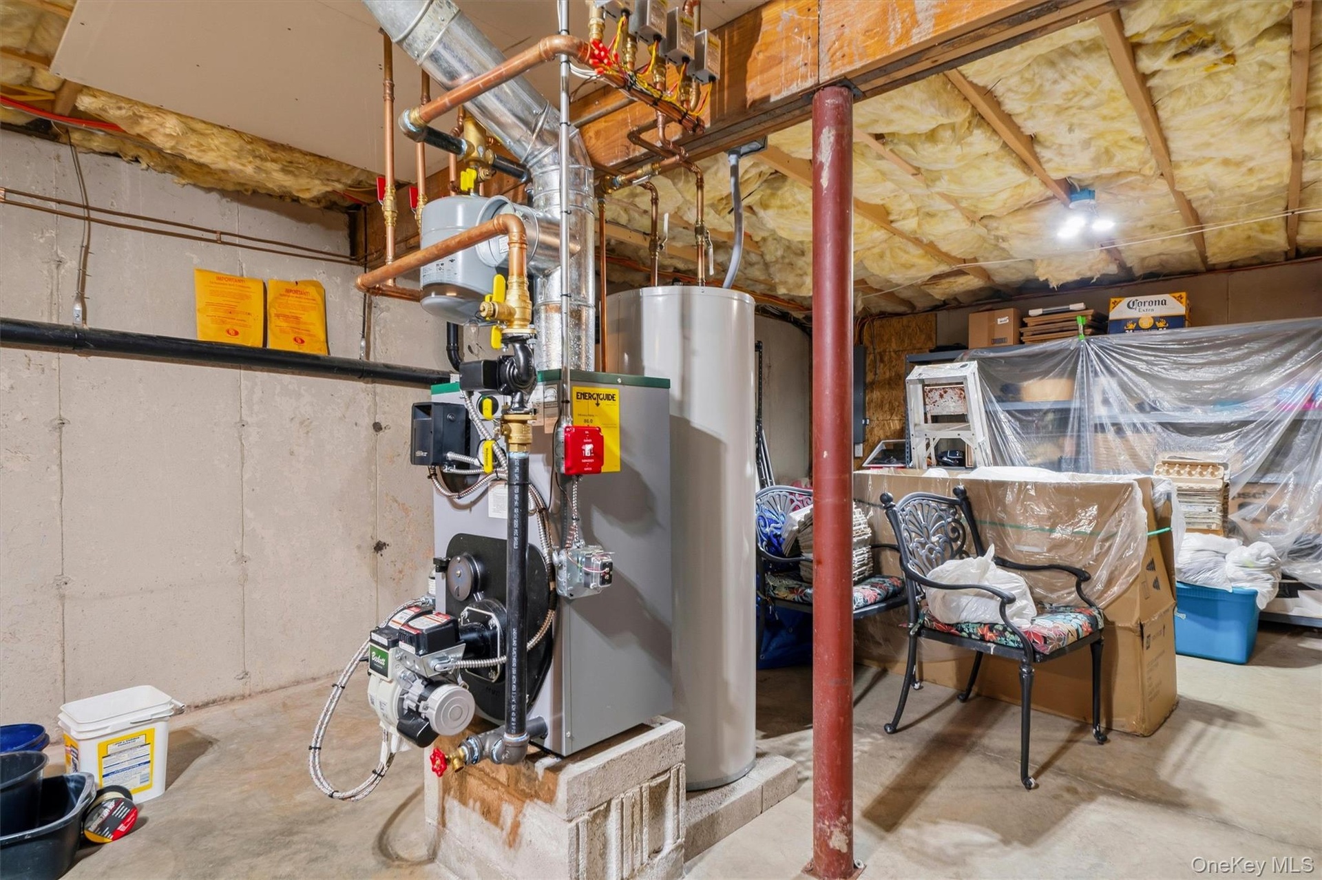 Unfinished basement with new furnace installed in 2026.