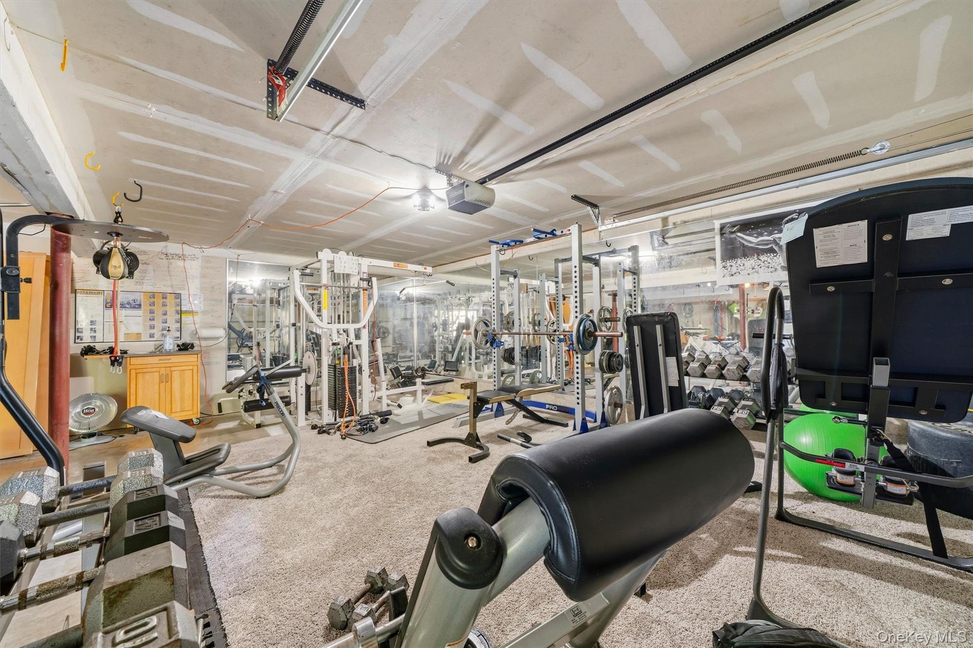 2 car garage currently used as an expansive exercise and weight room.  Equipment is available for sale if desired.