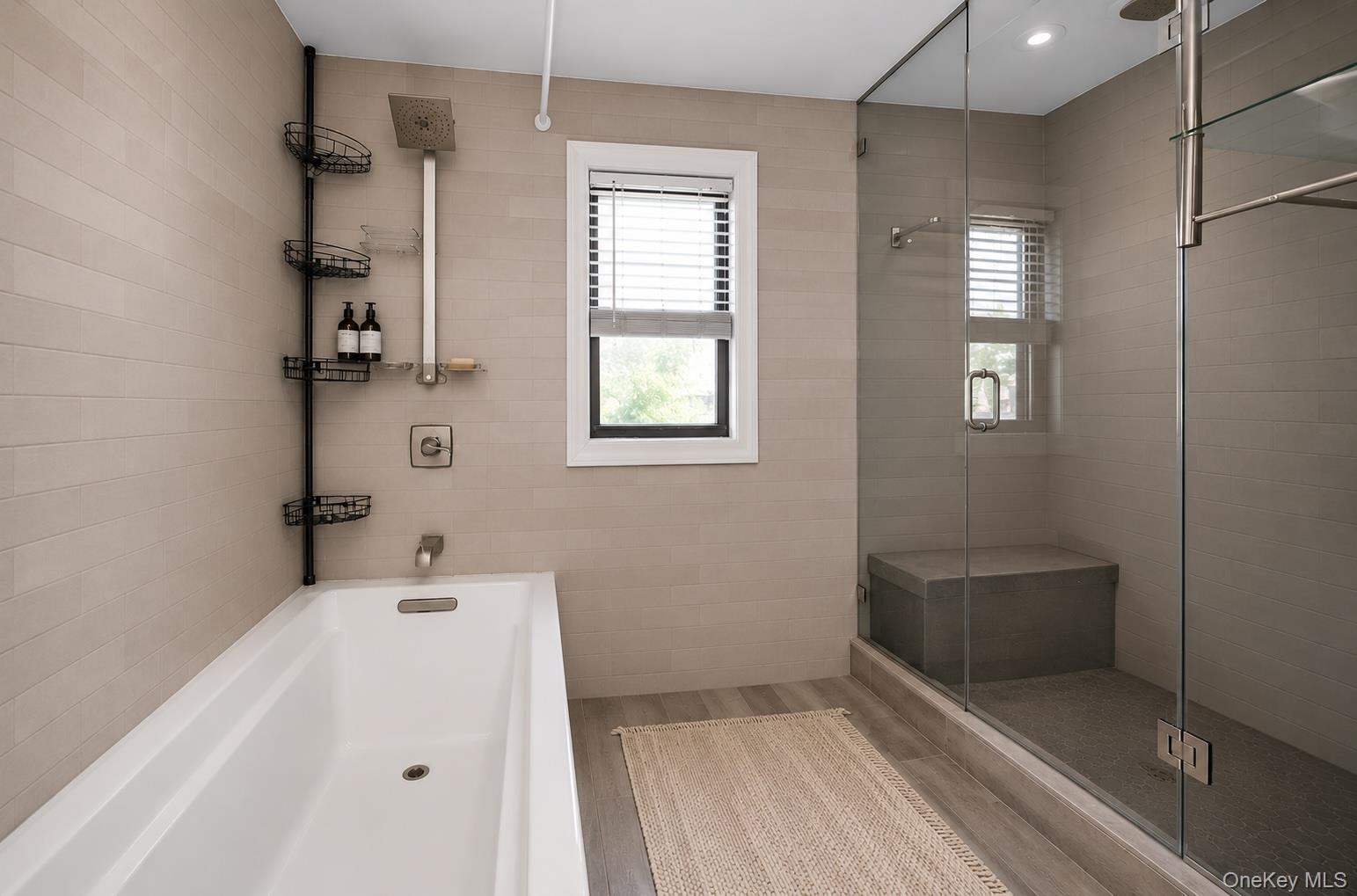 The second floor bathroom has both a tub and a shower.